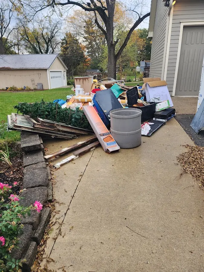 Dumpster being loaded with debris for Commercial Dumpster Rental in Jerseyville